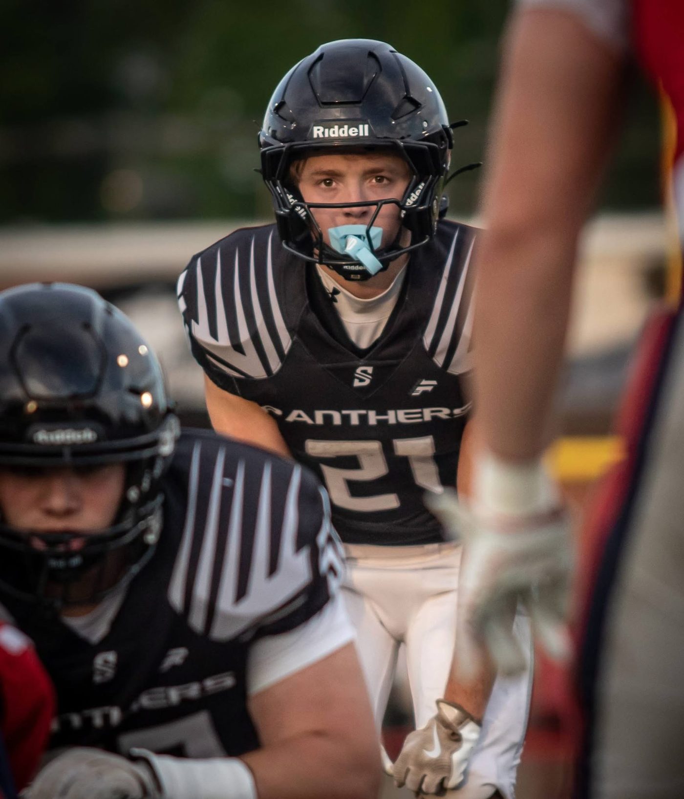 Panther #21 set at the line of scrimmage